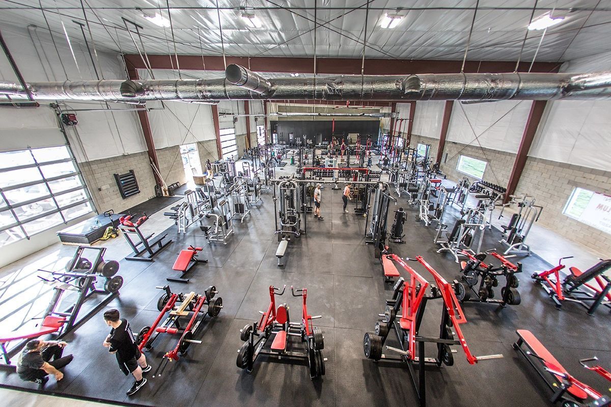 An aerial view of a large gym filled with lots of exercise equipment.