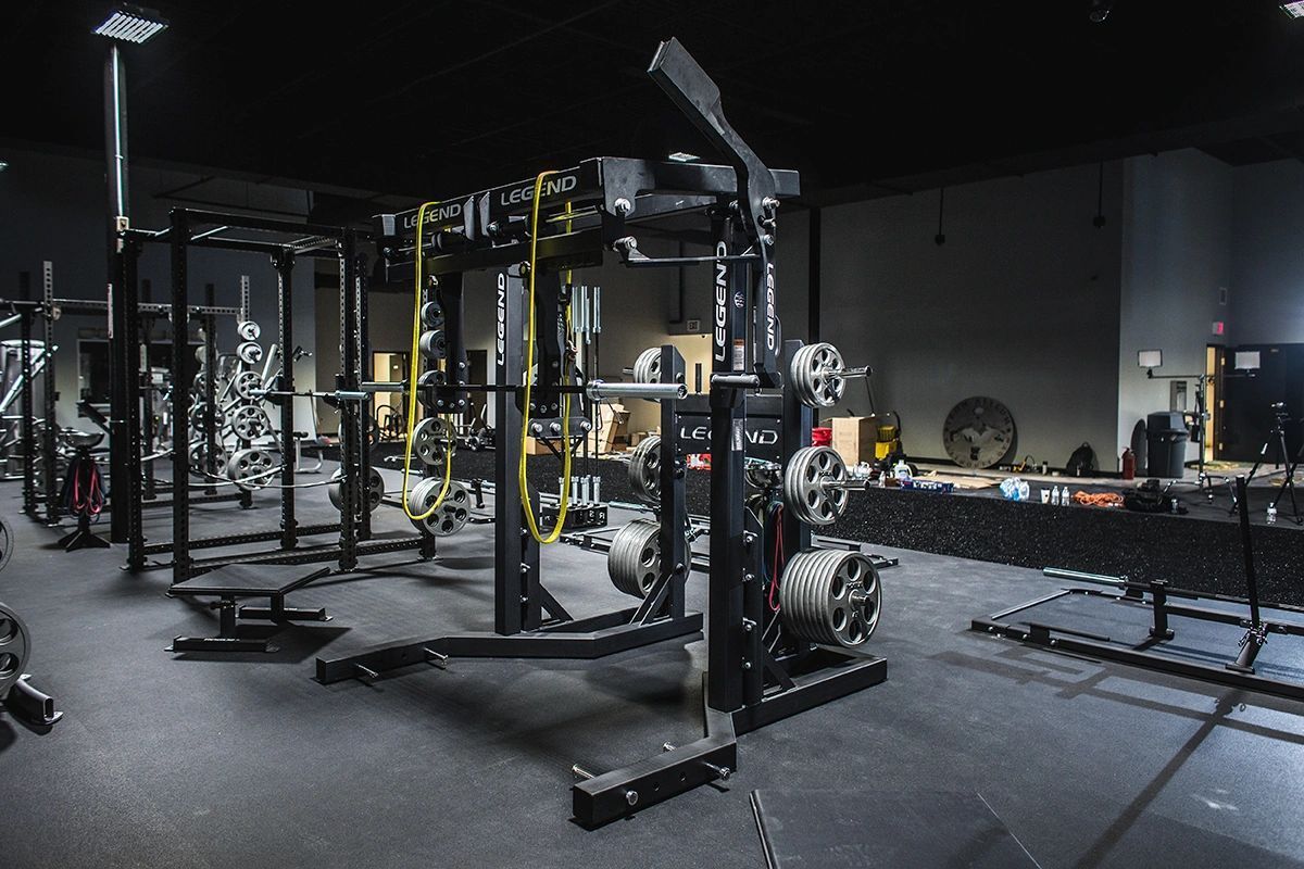 A gym with a lot of exercise equipment in it