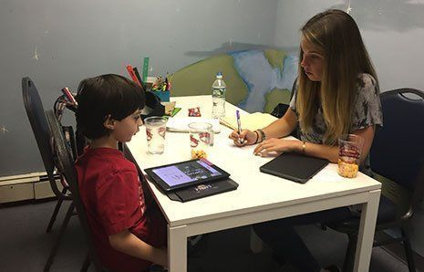 young boy with tutor