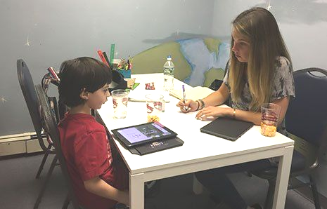 young boy with tutor