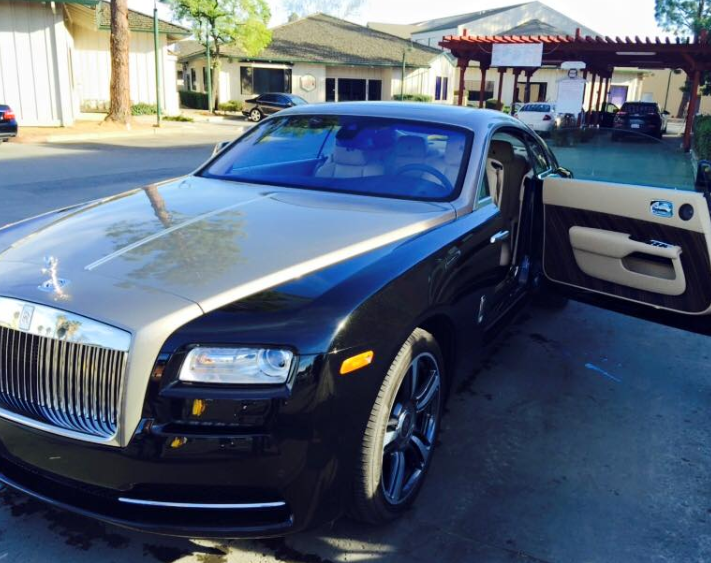 A close up of a rolls royce wheel