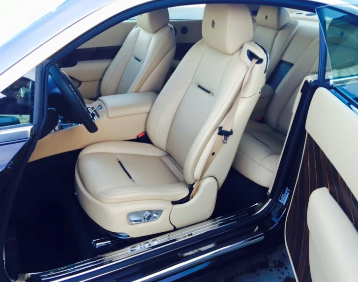 The inside of a car with the door open