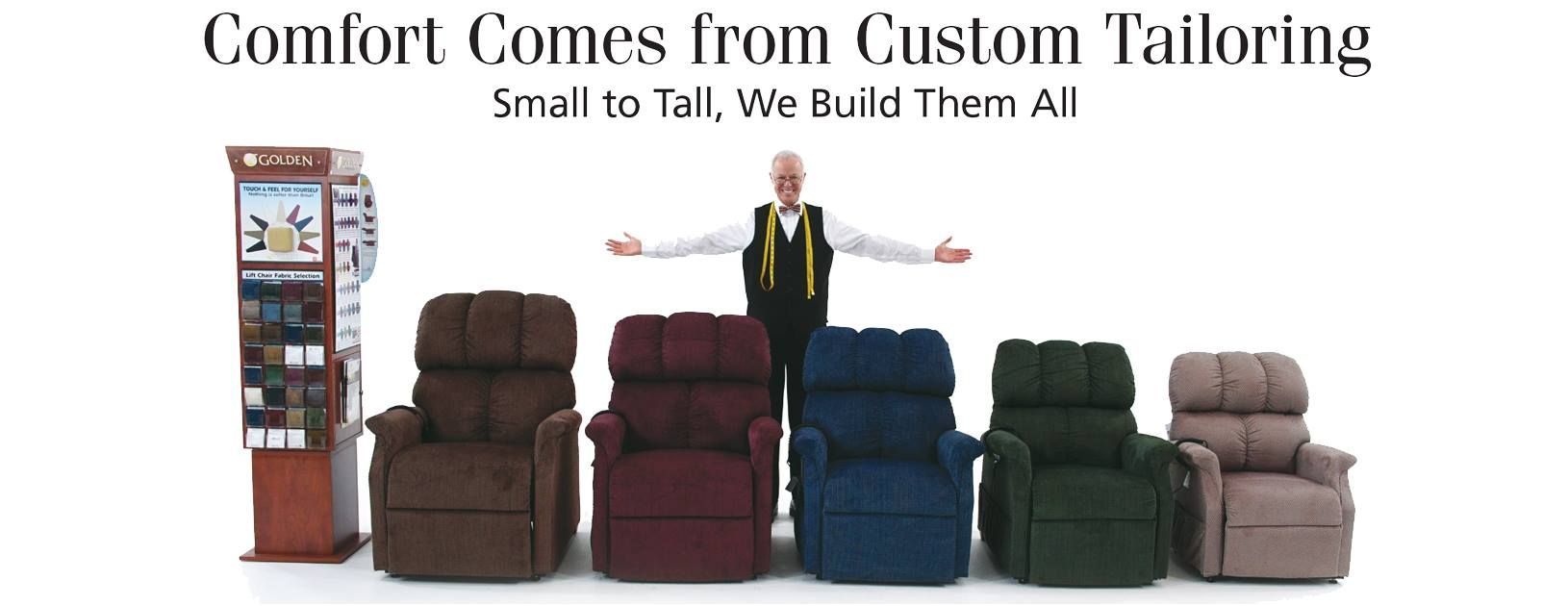 A man with his arms outstretched stands in front of various colored recliners. A display is to the left.