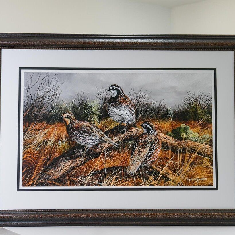 Framed wildlife print of quail in dry grass with muted earth tones