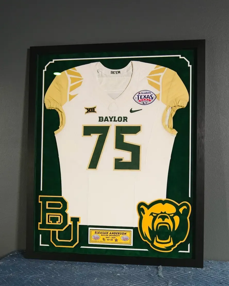 Framed Baylor football jersey with number 75, green and gold accents, and Baylor Bear logos