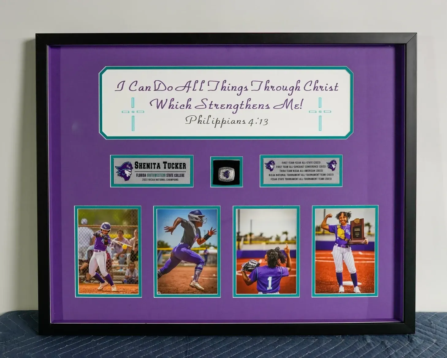 Framed purple sports tribute with Bible verse, sponsor plaques, and four baseball action photos