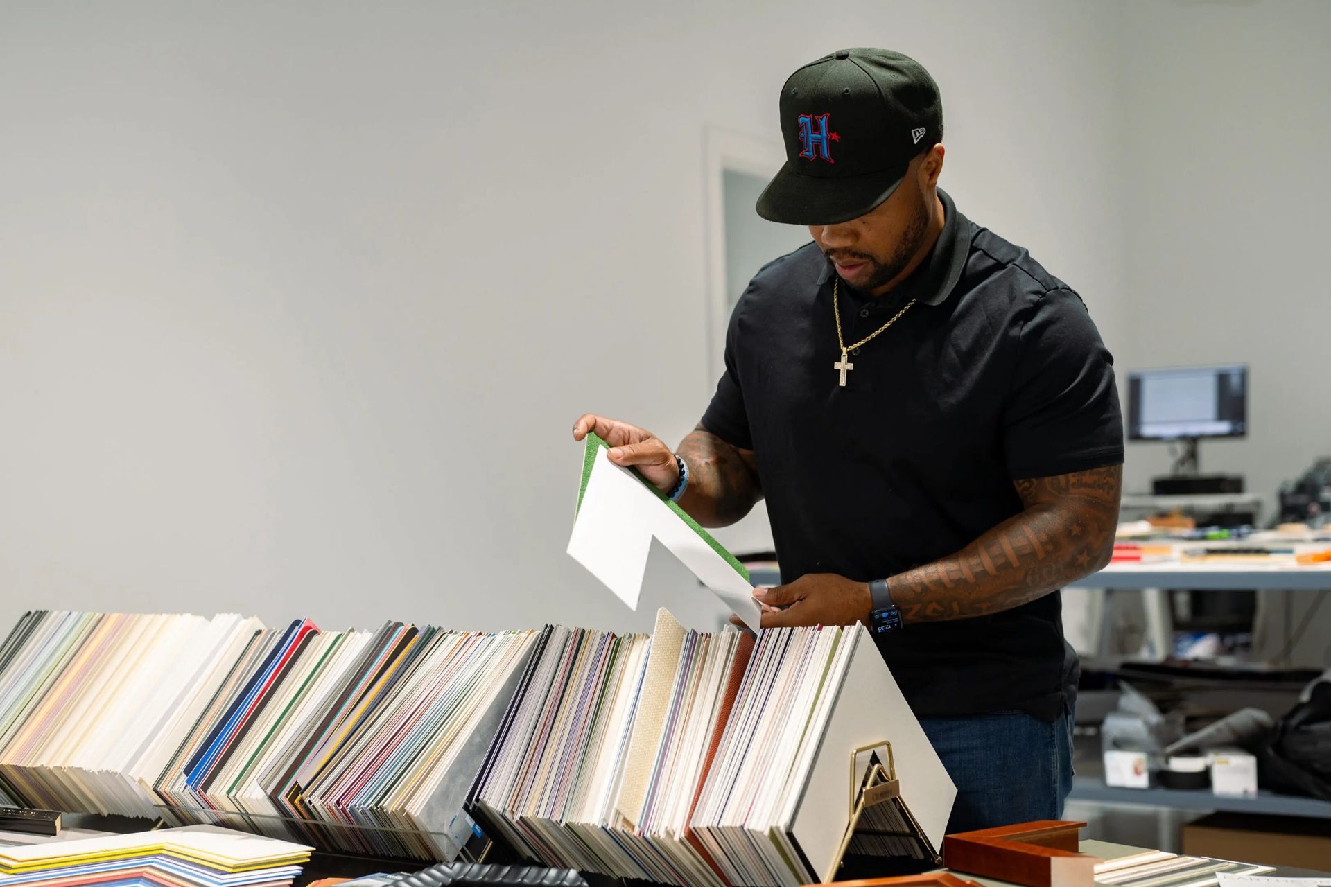 Man browsing vinyl records at a record store counter