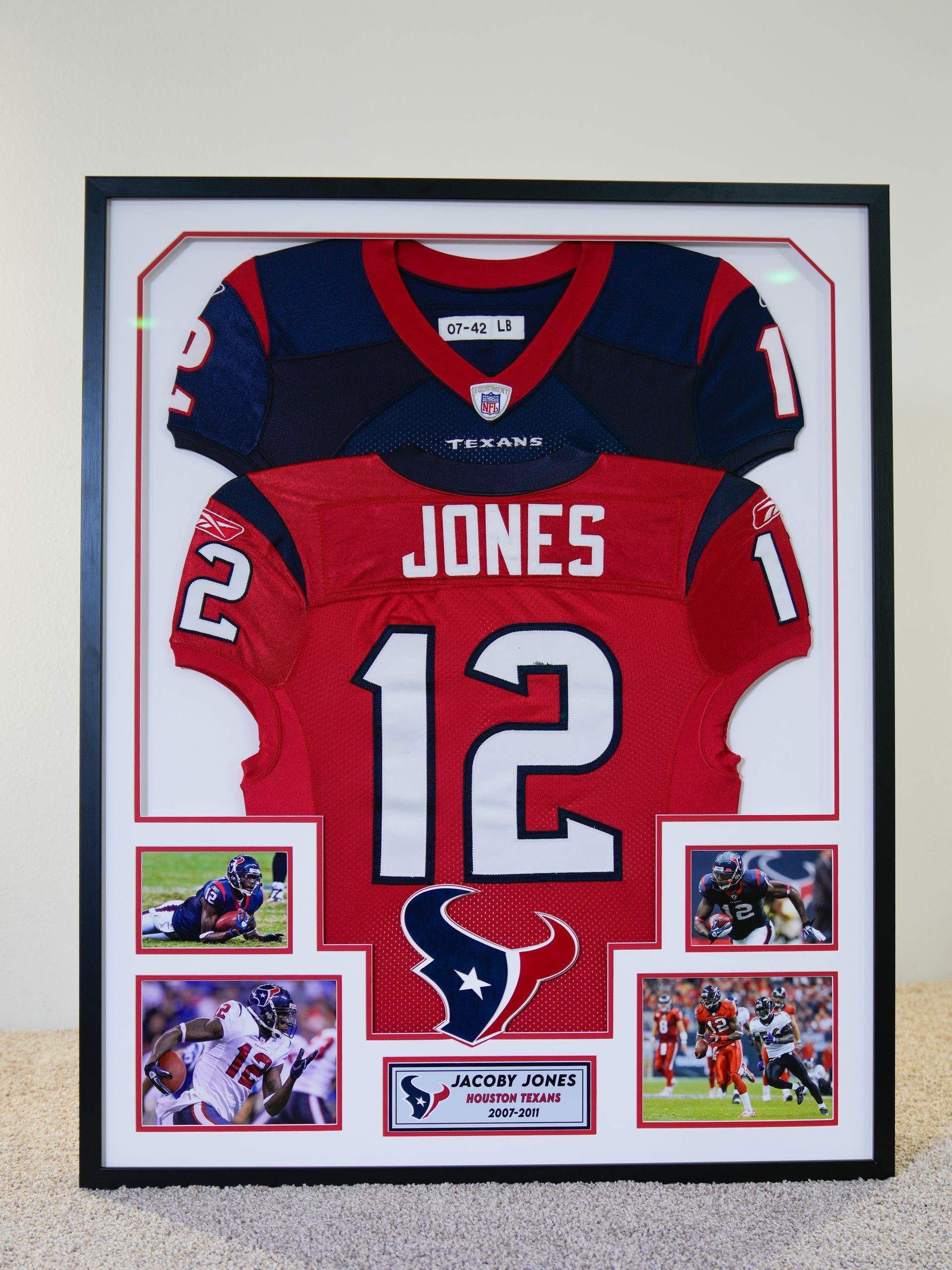 Framed Houston Texans red and navy jersey display with “JONES” and number 12, plus four small game photos