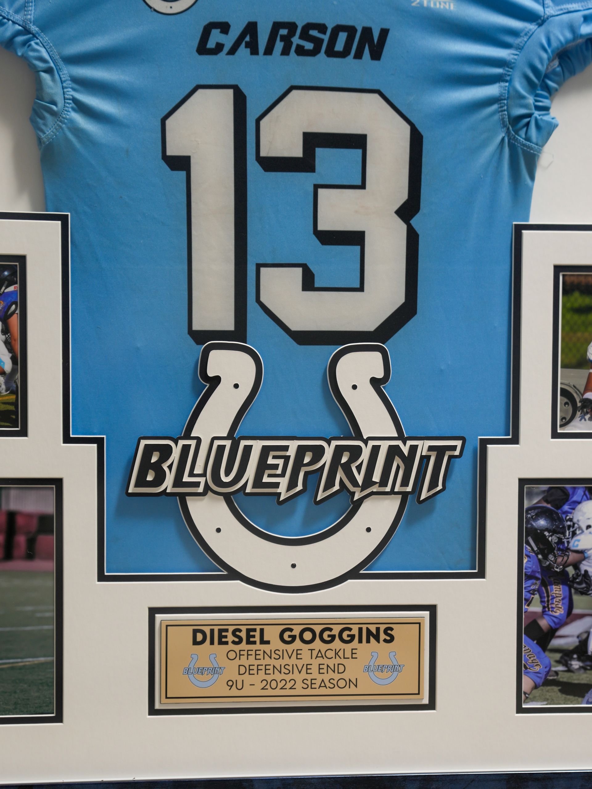 Framed blue Carson #13 football jersey with “Blueprint” and “Diesel Goggins” plaque
