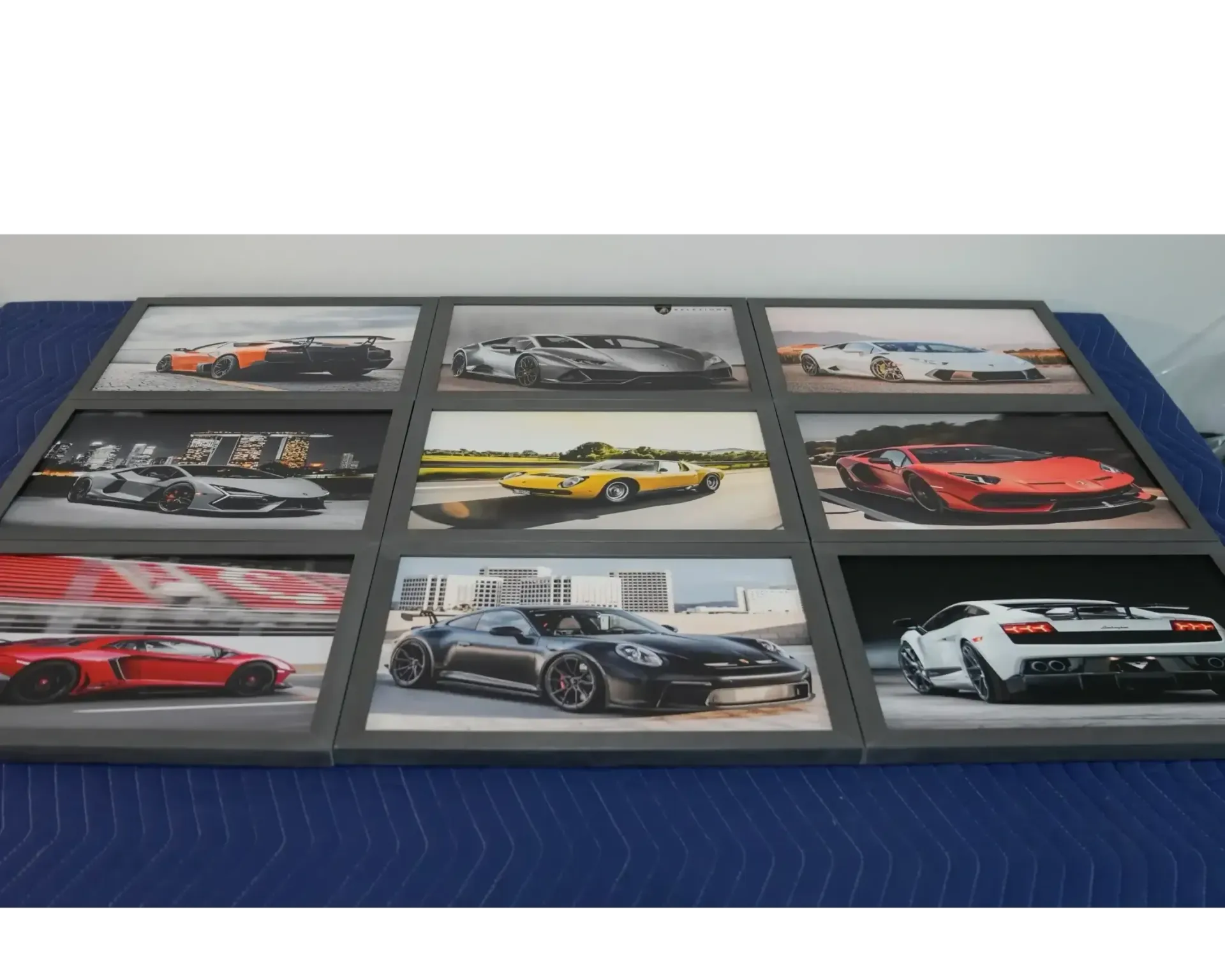 Framed collage of nine sports car photos on a blue surface