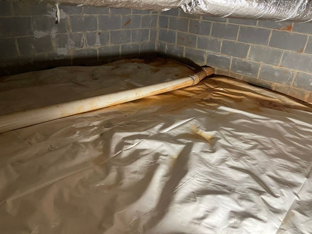 There is a pipe in the corner of the basement.