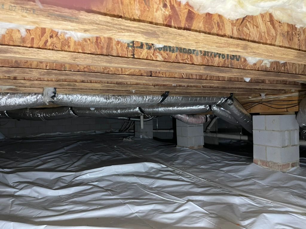 A picture of a crawl space under a house.