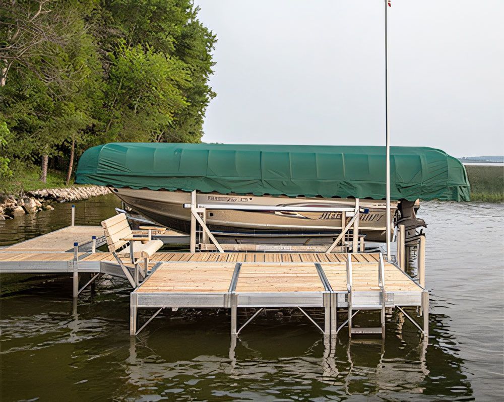 A boat is docked at a dock with a canopy over it