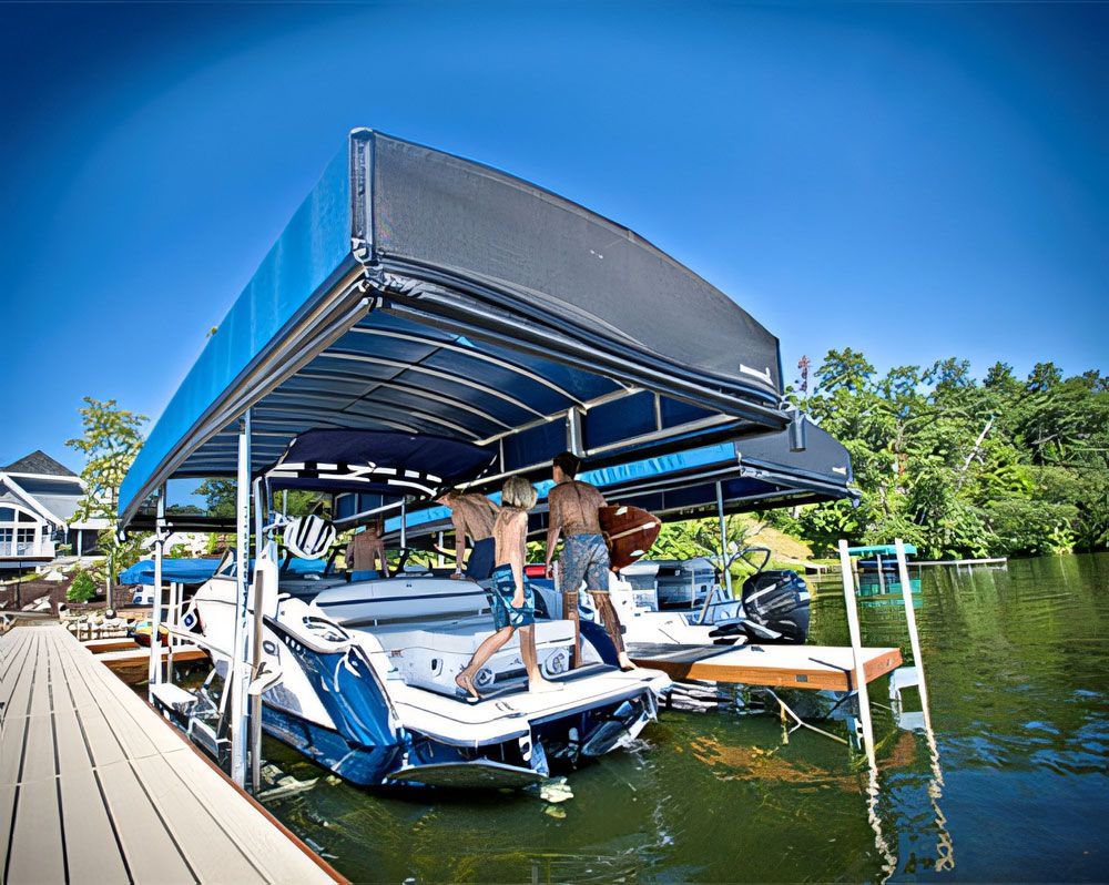 A boat with a canopy is docked at a dock