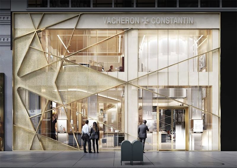 A group of people are standing in front of a vacheron constantin store.