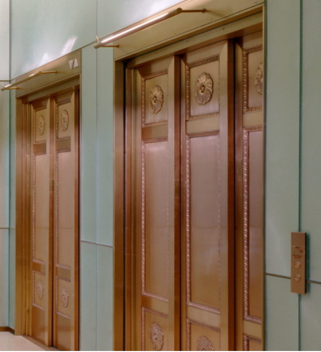 A row of wooden doors in a hallway with the number 7 on them