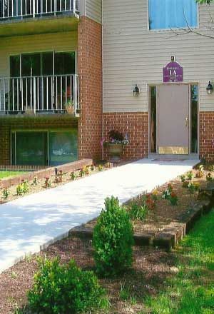 A house with a walkway leading to the front door