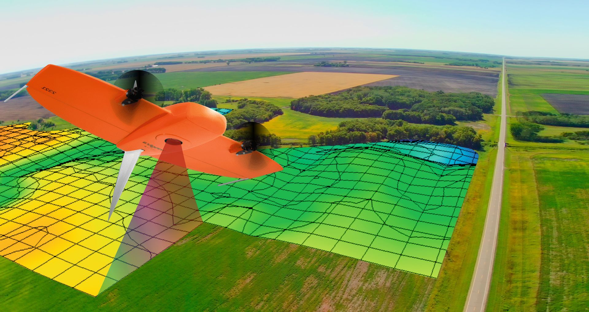 An aerial view of a drone flying over a field.