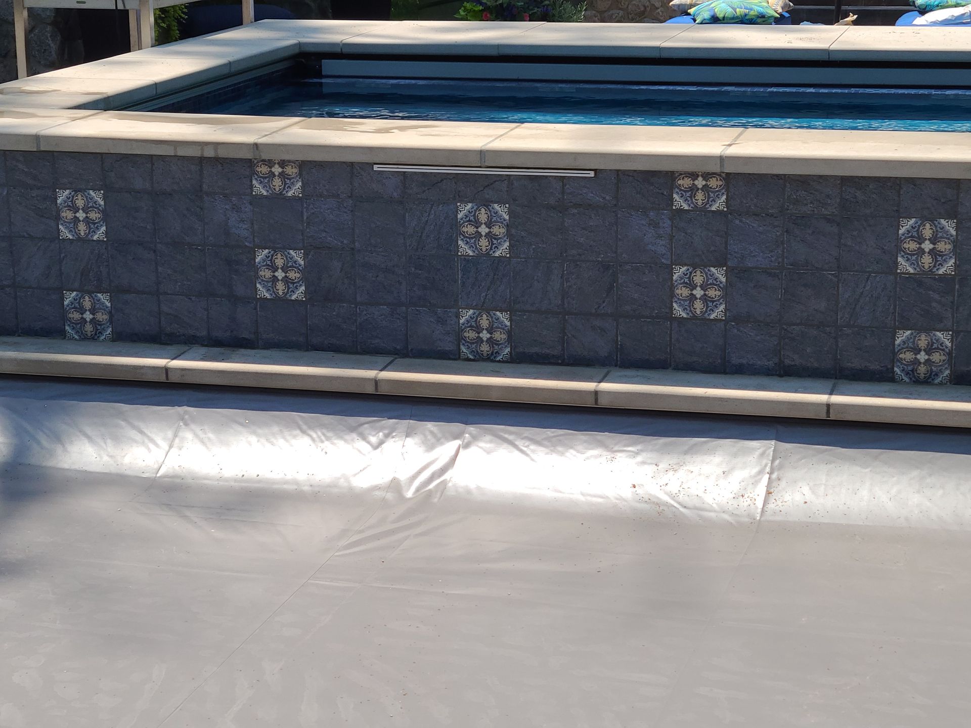 A swimming pool with a cover on top of it.