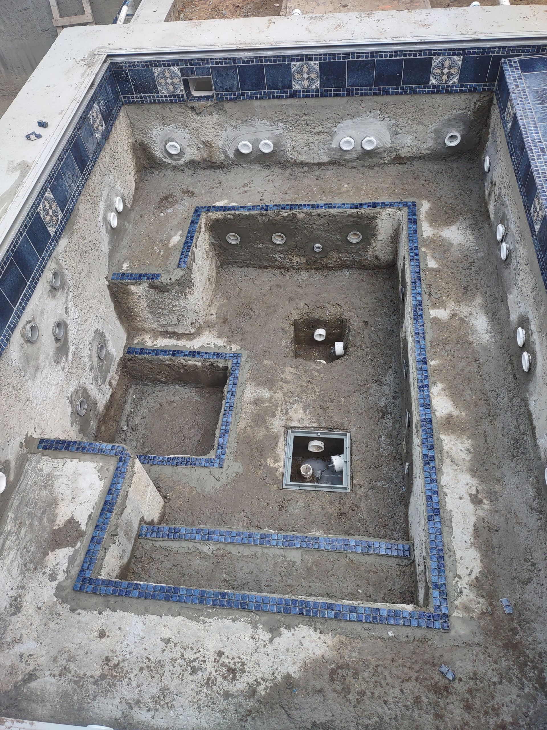 The inside of a swimming pool is being remodeled.