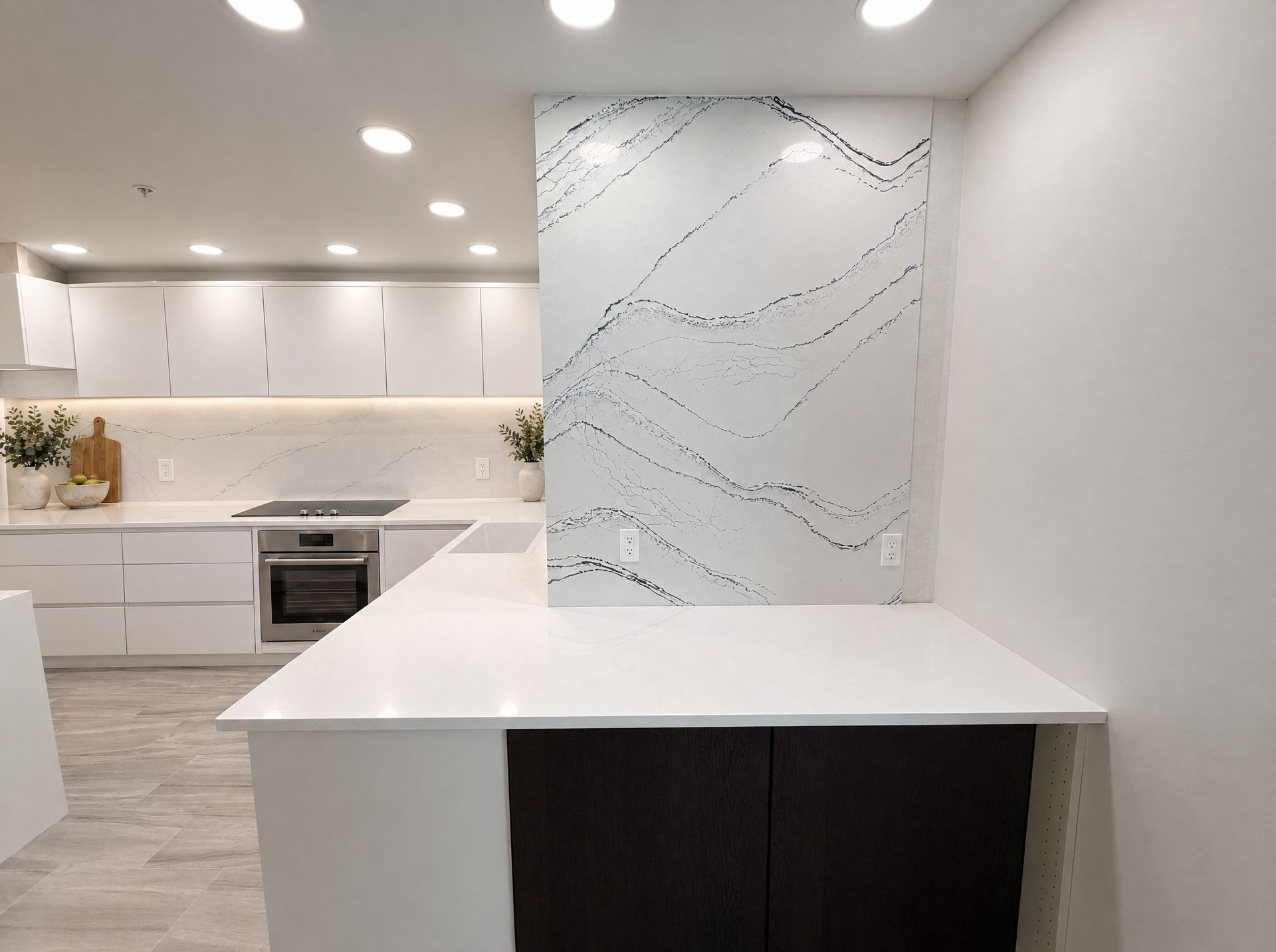 Peninsula top with the wavy feature wall behind