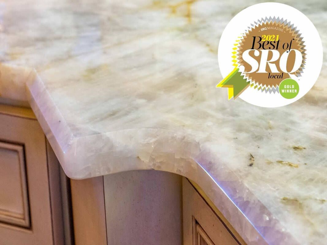 a marble counter top with a best of srq sticker
