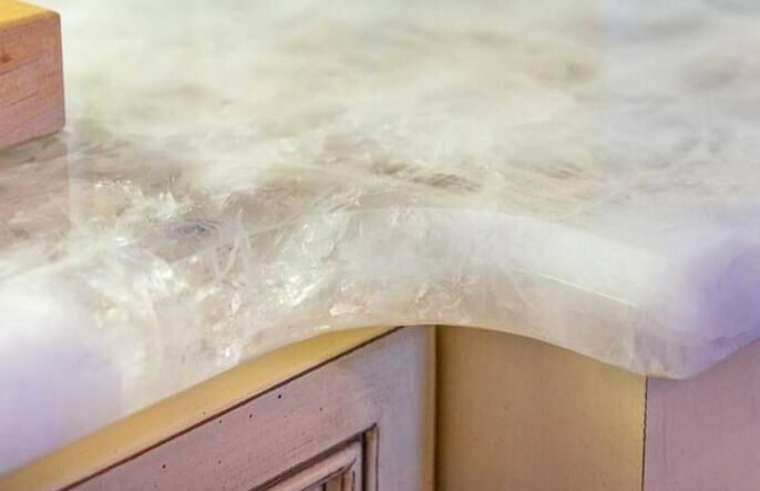 a close up of a marble counter top in a kitchen