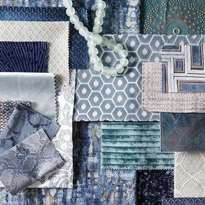 Fabric swatches in various blue hues with a string of light-blue beads.
