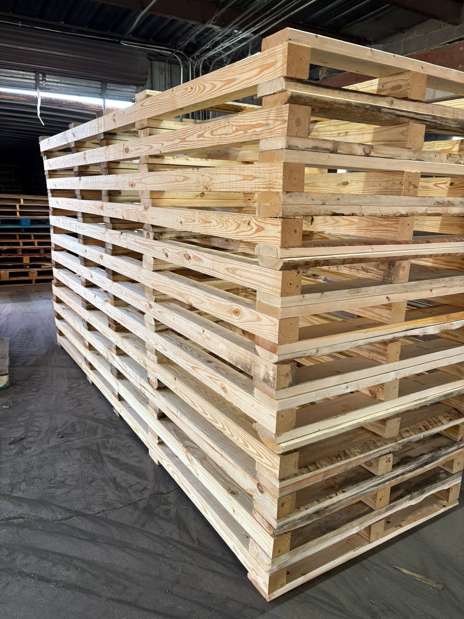 Stacked wooden pallets in a warehouse