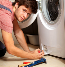 Man repairing an appliance
