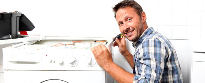 Man repairing a dryer