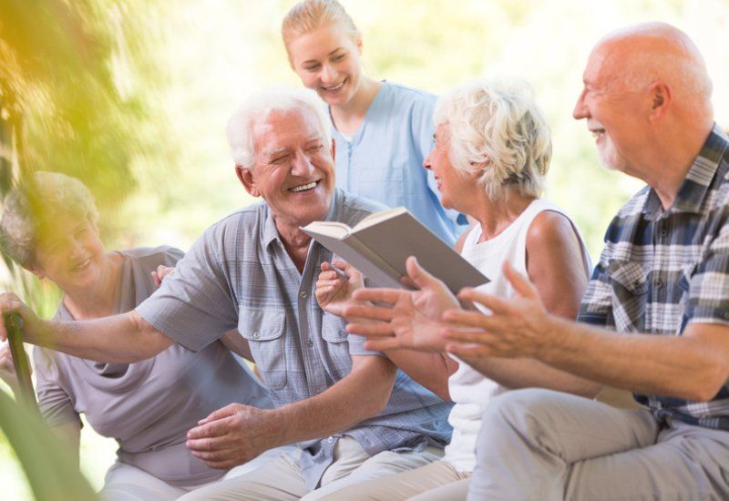 A group elderly people laughing together