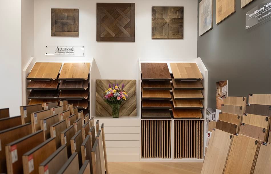 Showroom with rows of wooden folding chairs and sample wood panels on the walls