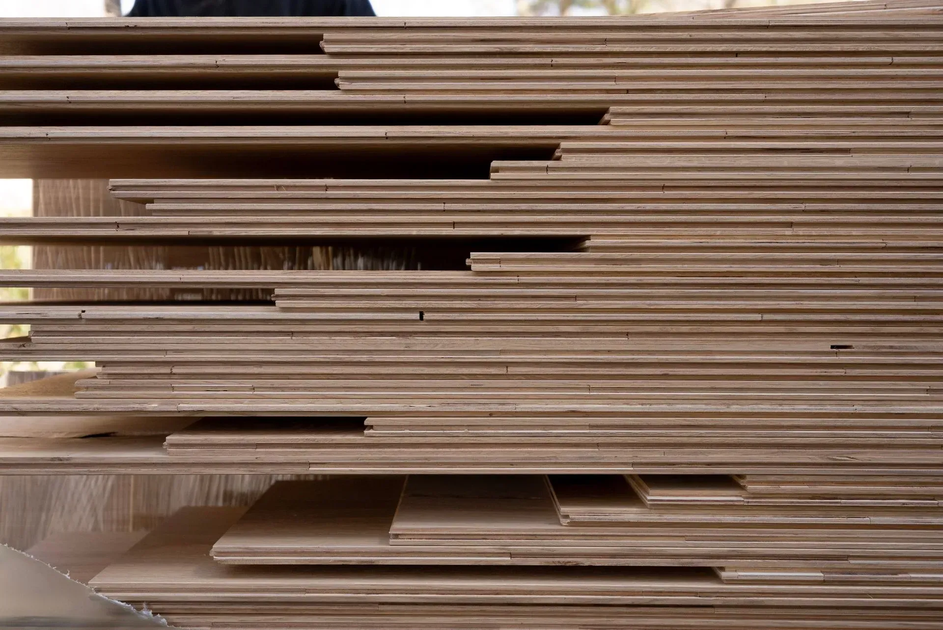 Abstract horizontal brown and beige streaks, resembling layered wood or motion blur