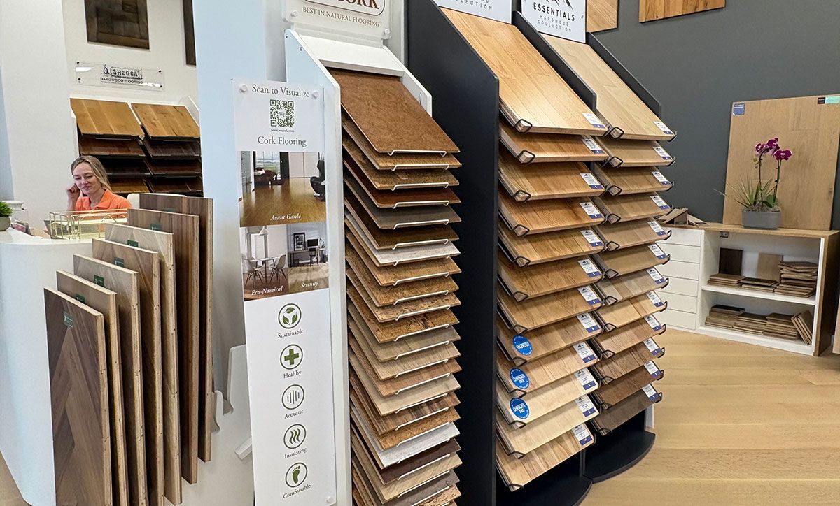 Store display of wooden samples and stacked cardboard or wood panels on showroom racks