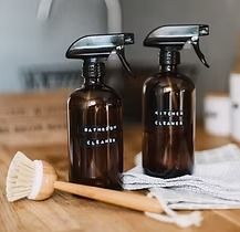 Two brown spray bottles labeled