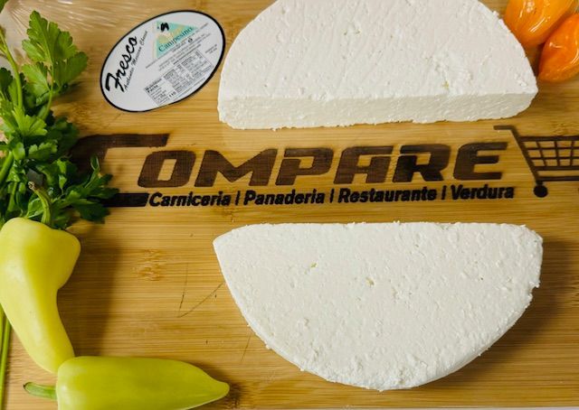 A cutting board with the word compare on it