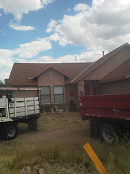 Two trucks outside the house