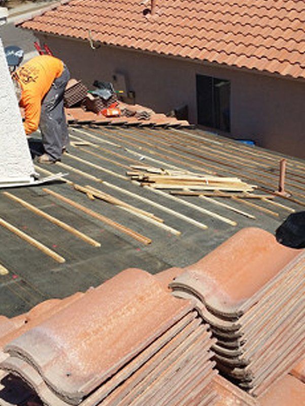 Man installing tile roof