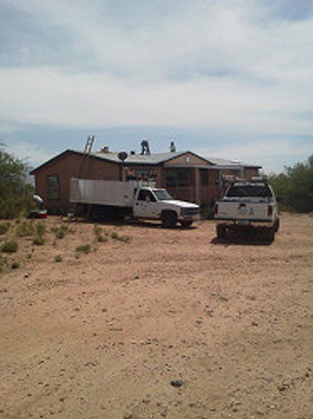 Two trucks outside residential house