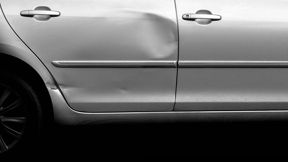 Dented silver door