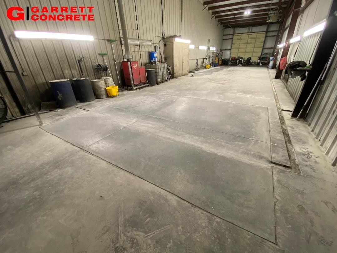 a large warehouse with a concrete floor