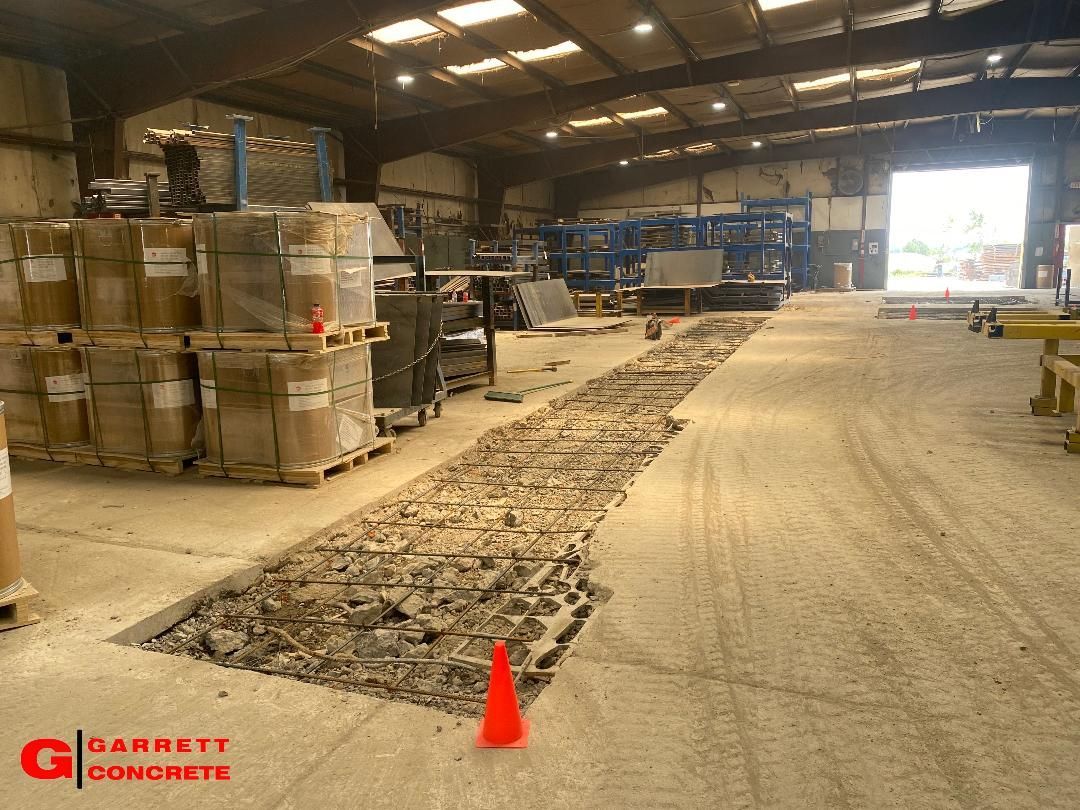 a large warehouse filled with lots of boxes and a red cone