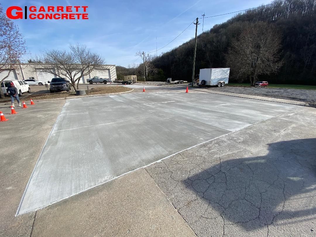 a concrete driveway is being built in a parking lot