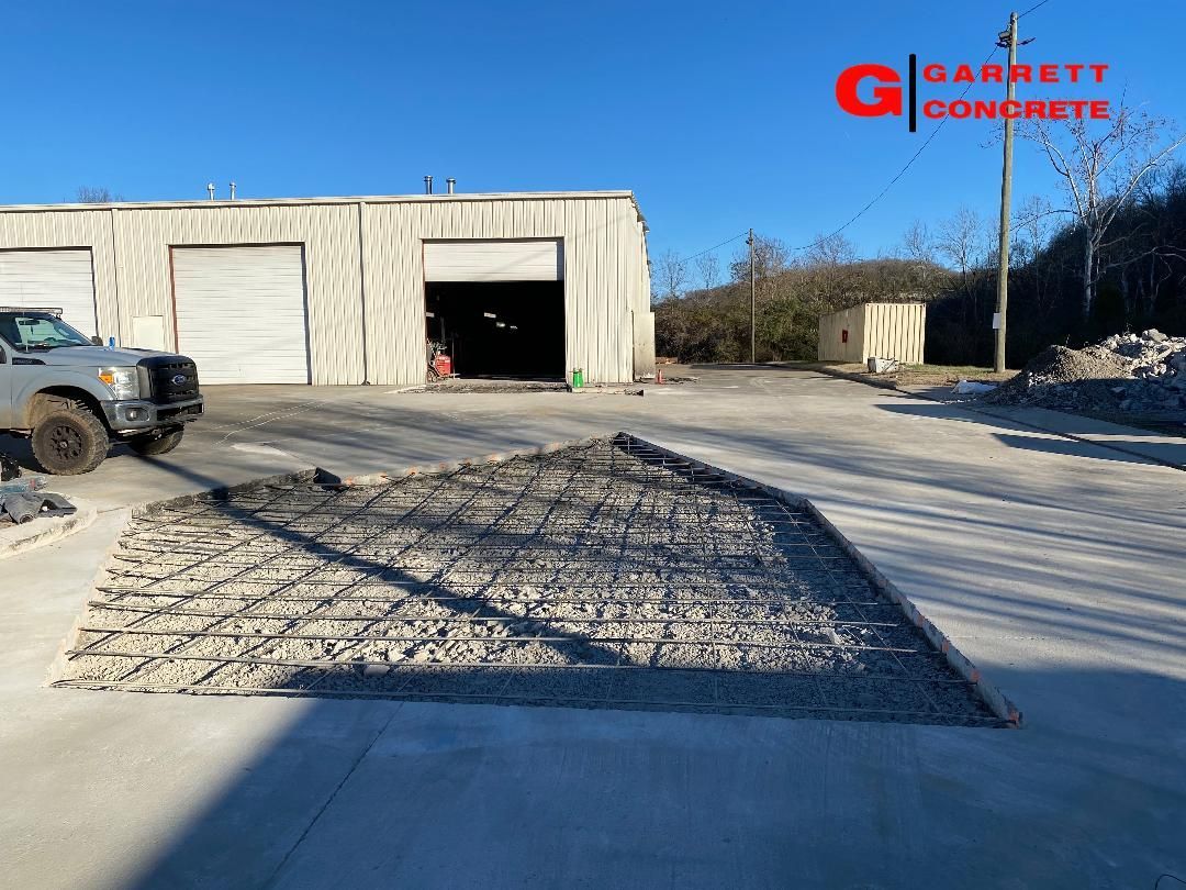 a truck is parked in front of a building that is being built