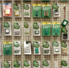 A peg board displays a variety of batteries