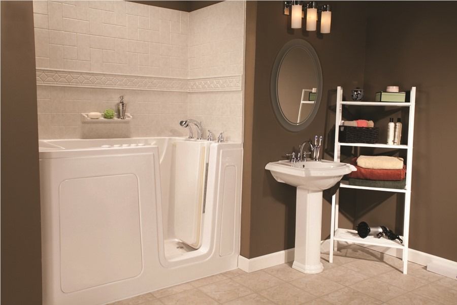 Laundry room with washer, dryer, sink, wall mirror, and shelving on tile floor