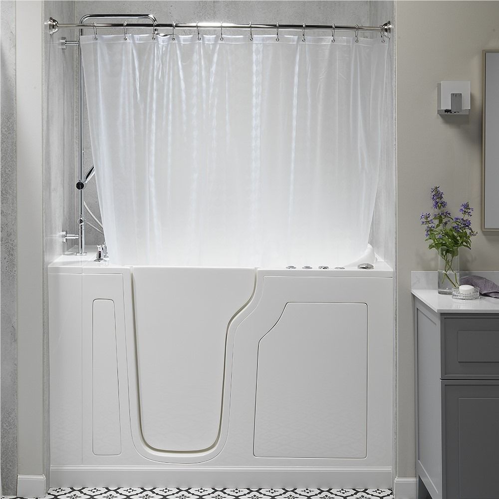 White walk-in bathtub with shower curtain in a bathroom, beside a gray vanity and wall decor