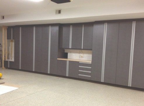 A garage with a lot of cabinets and drawers