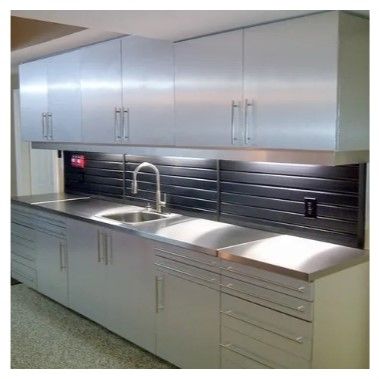 A kitchen with stainless steel cabinets and a sink.